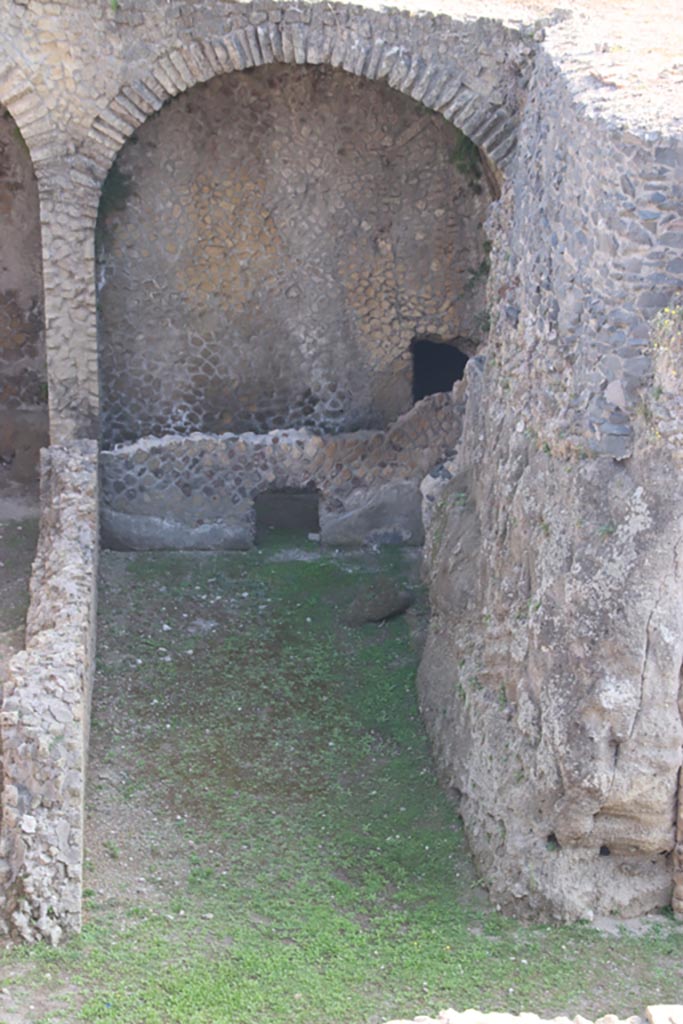III.1/2/18/19, Herculaneum, October 2023. 
Looking north from access roadway towards room F, with corridor at rear.
Photo courtesy of Klaus Heese.
